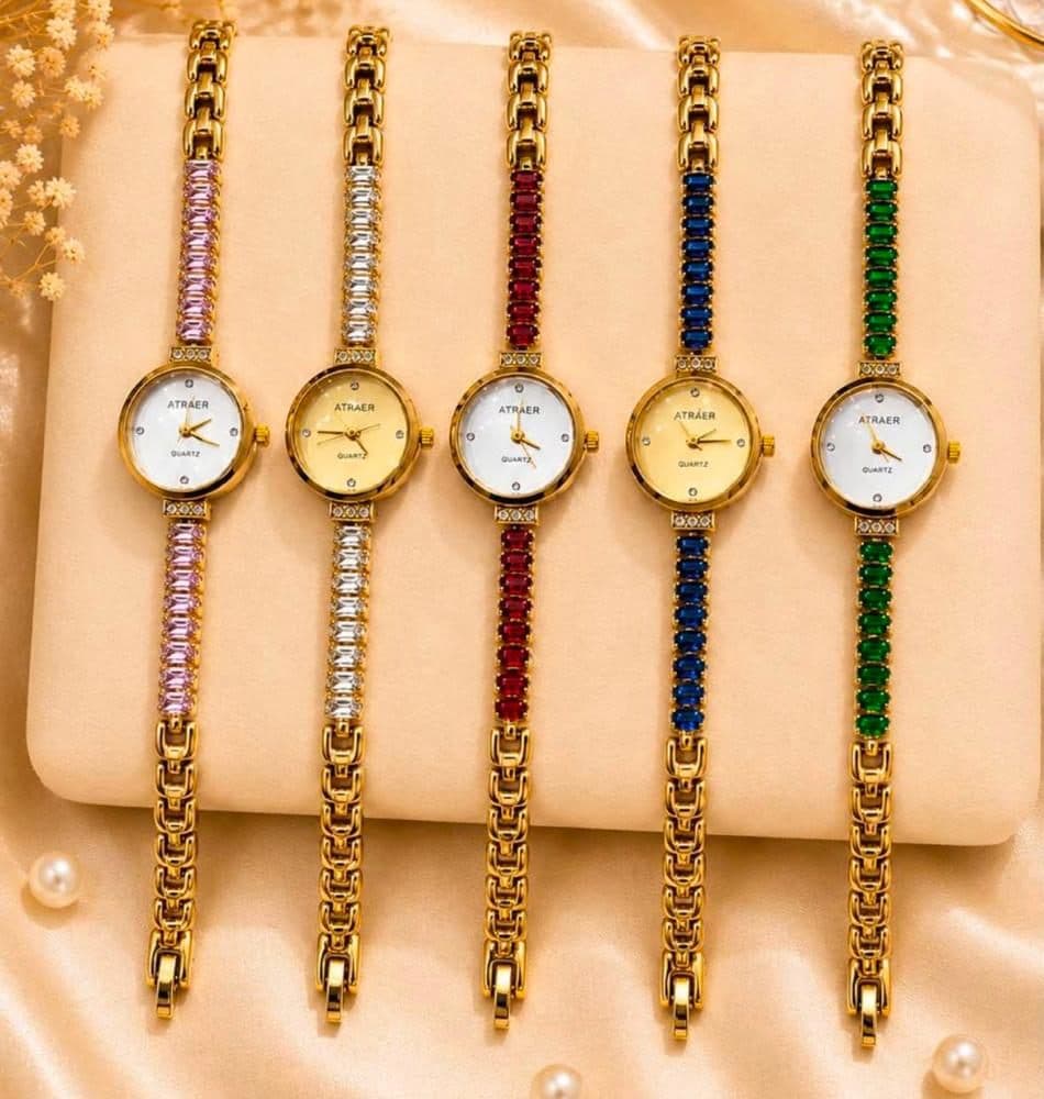 Five slim gold watches with stone-set bracelets